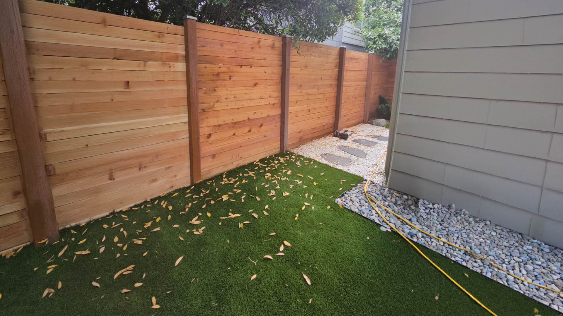 Wood Privacy Fence Installation in Washington by Ecua Landscaping, photo 3 of 6